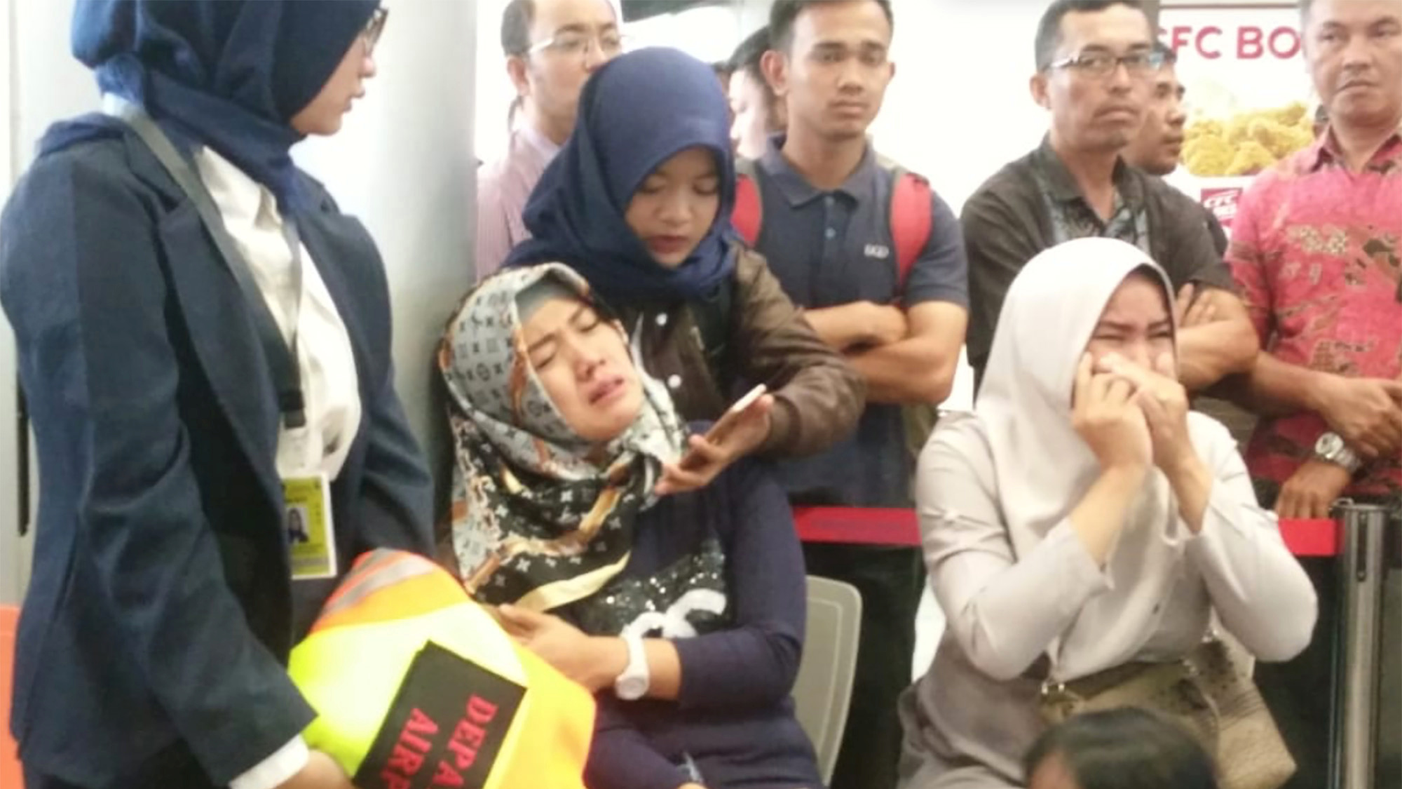 Relatives of passengers of Lion Air flight JT610 that crashed into the sea cry at the airport on Monday in Pangkal Pinang, Indonesia, where the plane was bound. (Reuters)
