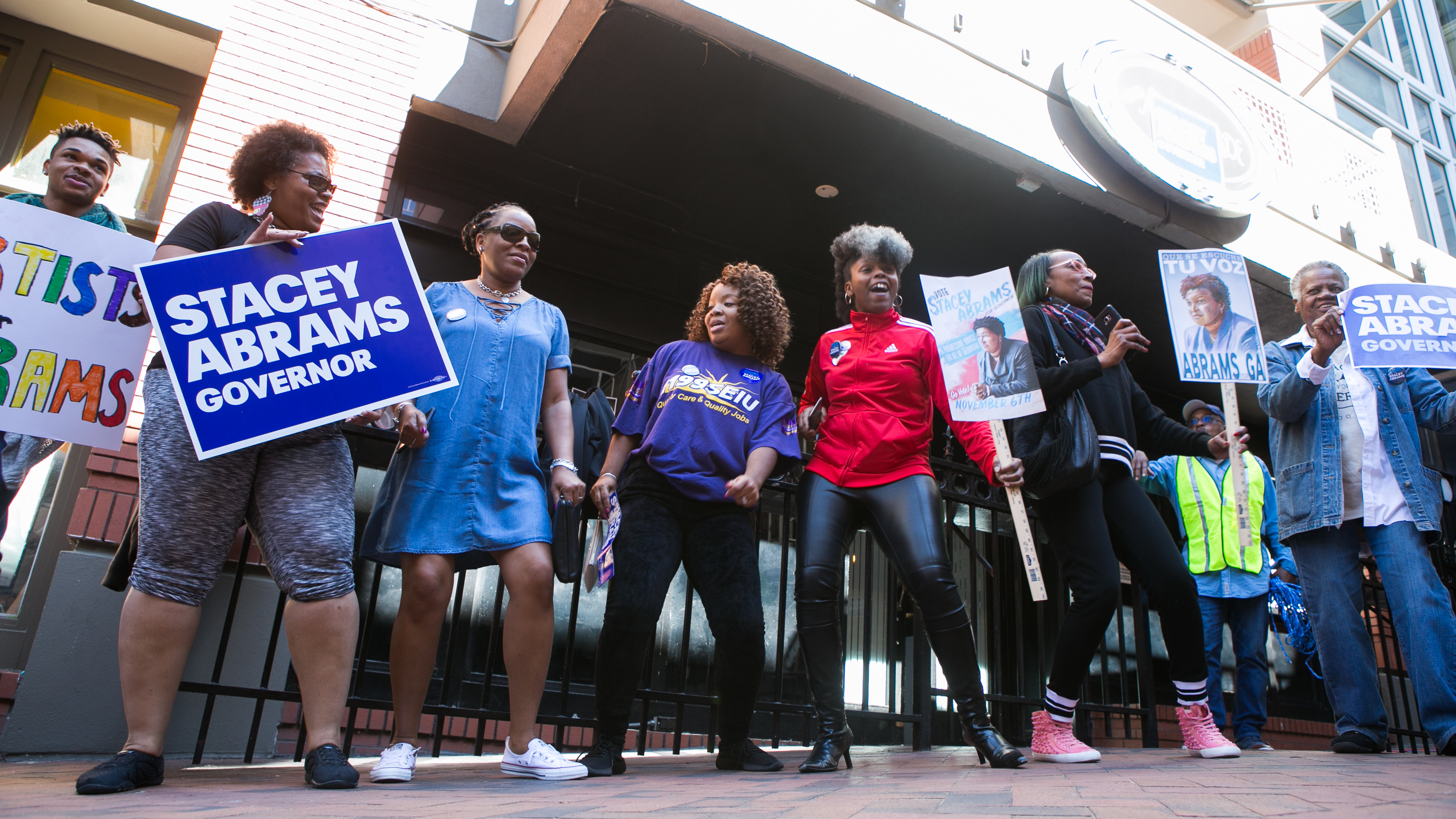 Georgia voters and supporters dance and sing during a &quot;Souls to The Polls&quot; march hosted by Democratic Georgia gubernatorial candidate Stacey Abrams in downtown Atlanta on Oct. 28. Alongside artist Common and Ambassador Andrew Young, Abrams marched with voters to a polling station in downtown Atlanta. (Getty Images)
