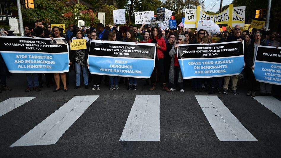 People protesting against President Trump gather near the Tree of Life Congregation, the site of a deadly shooting over the weekend, on Wednesday in Pittsburgh. (Brendan Smialowski/AFP/Getty Images)