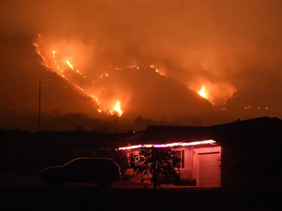 Flames from the Thomas Fire burn in the hills above Carpinteria, California, Dec. 11, 2017. (Robyn Beck/AFP/Getty Images)