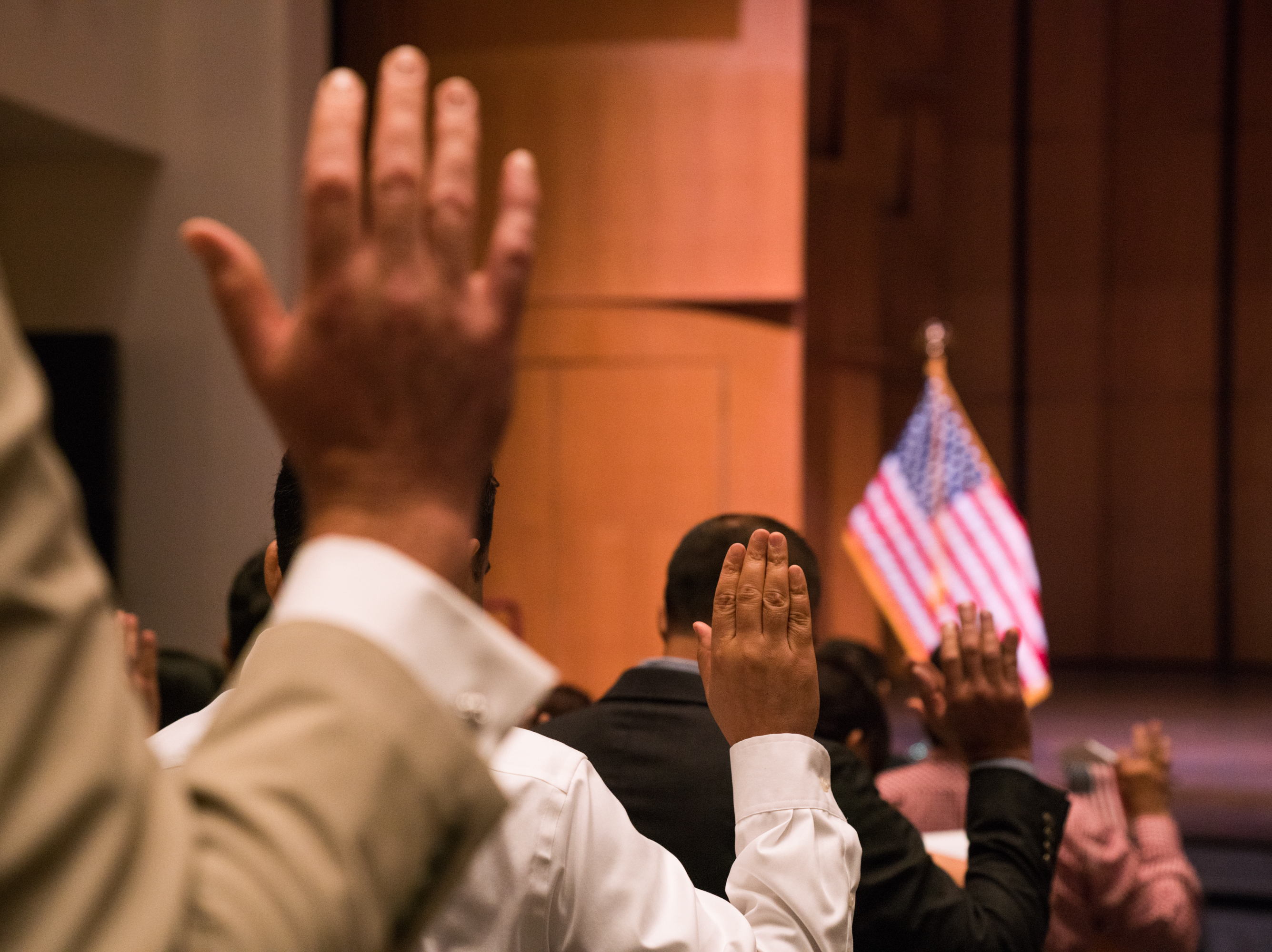 Newly sworn-in U.S. citizens gather for a naturalization ceremony at the Rachel M. Schlesinger Concert Hall and Arts Center in Alexandria, Va., in August. The Trump administration is planning to include a question about U.S. citizenship status on the 2020 census. (NPR)