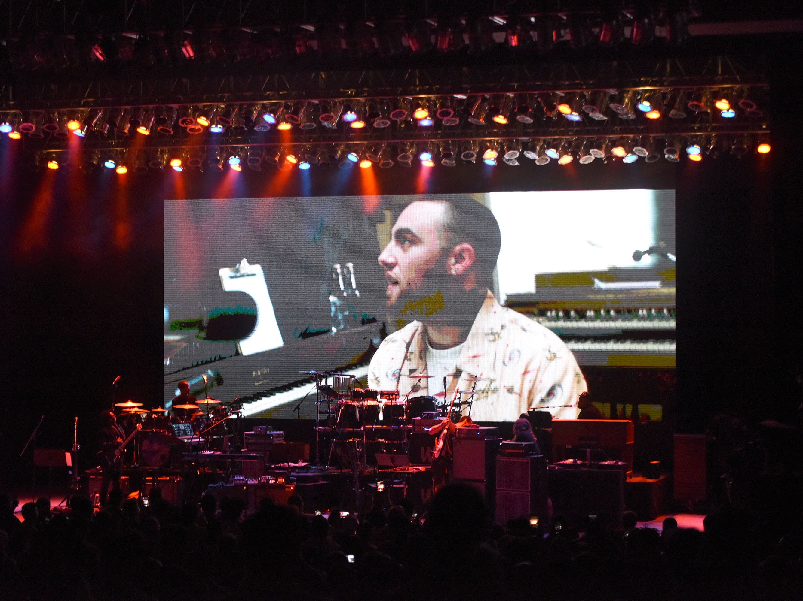 An image of Mac Miller, who died suddenly in September, projected on the rear of the stage at the Greek Theatre in Los Angeles, Calif., before a benefit concert organized in Miller's honor. (Getty Images)