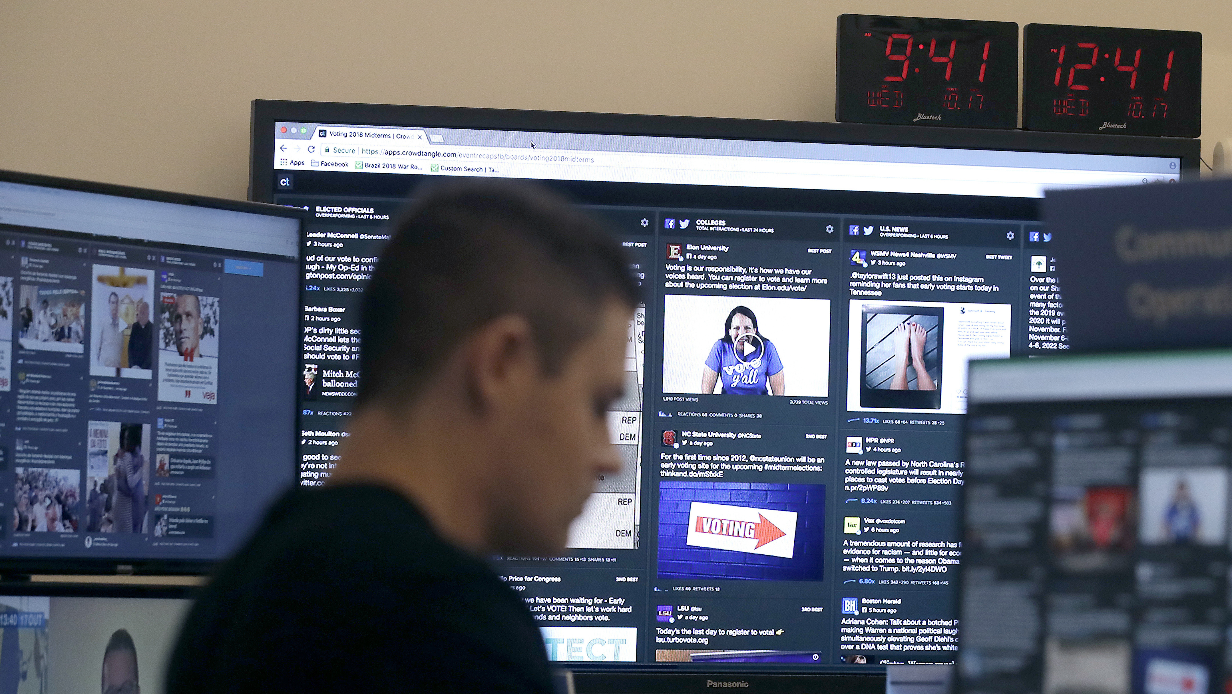 A man works at his desk in front of monitors last month during a demonstration in the war room, where Facebook monitors election-related content on the platform, in Menlo Park, Calif.