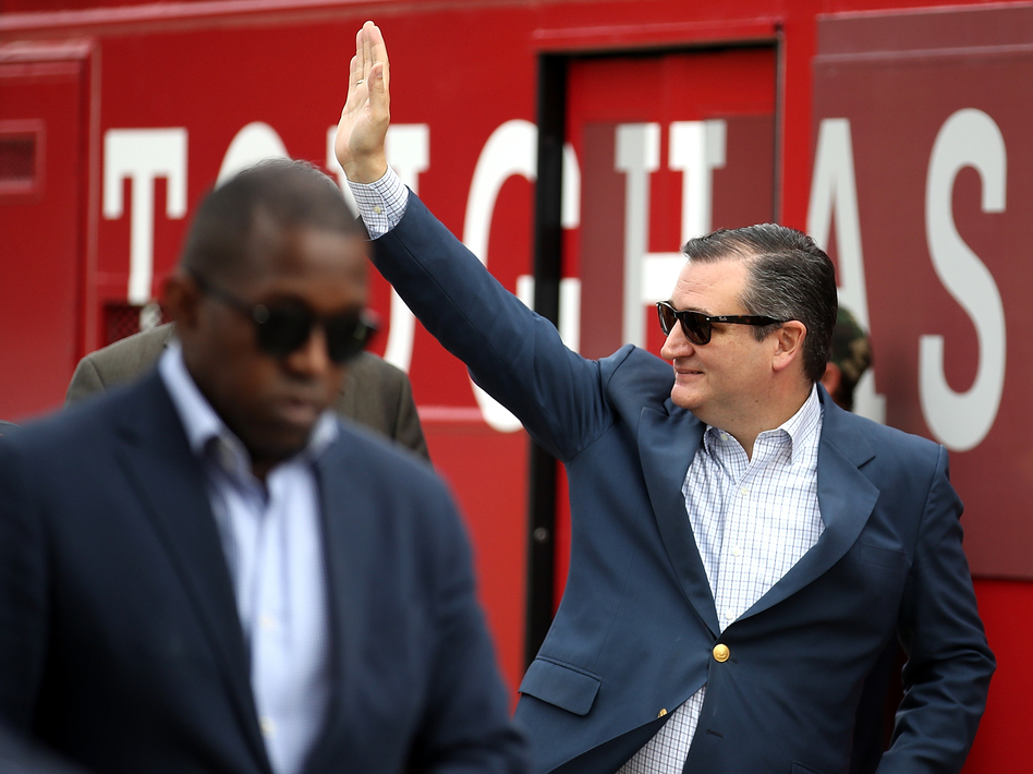 Sen. Ted Cruz waves to supporters as he arrives at a Get Out The Vote Bus Tour rally on Monday in Cypress, Texas. (Justin Sullivan/Getty Images)