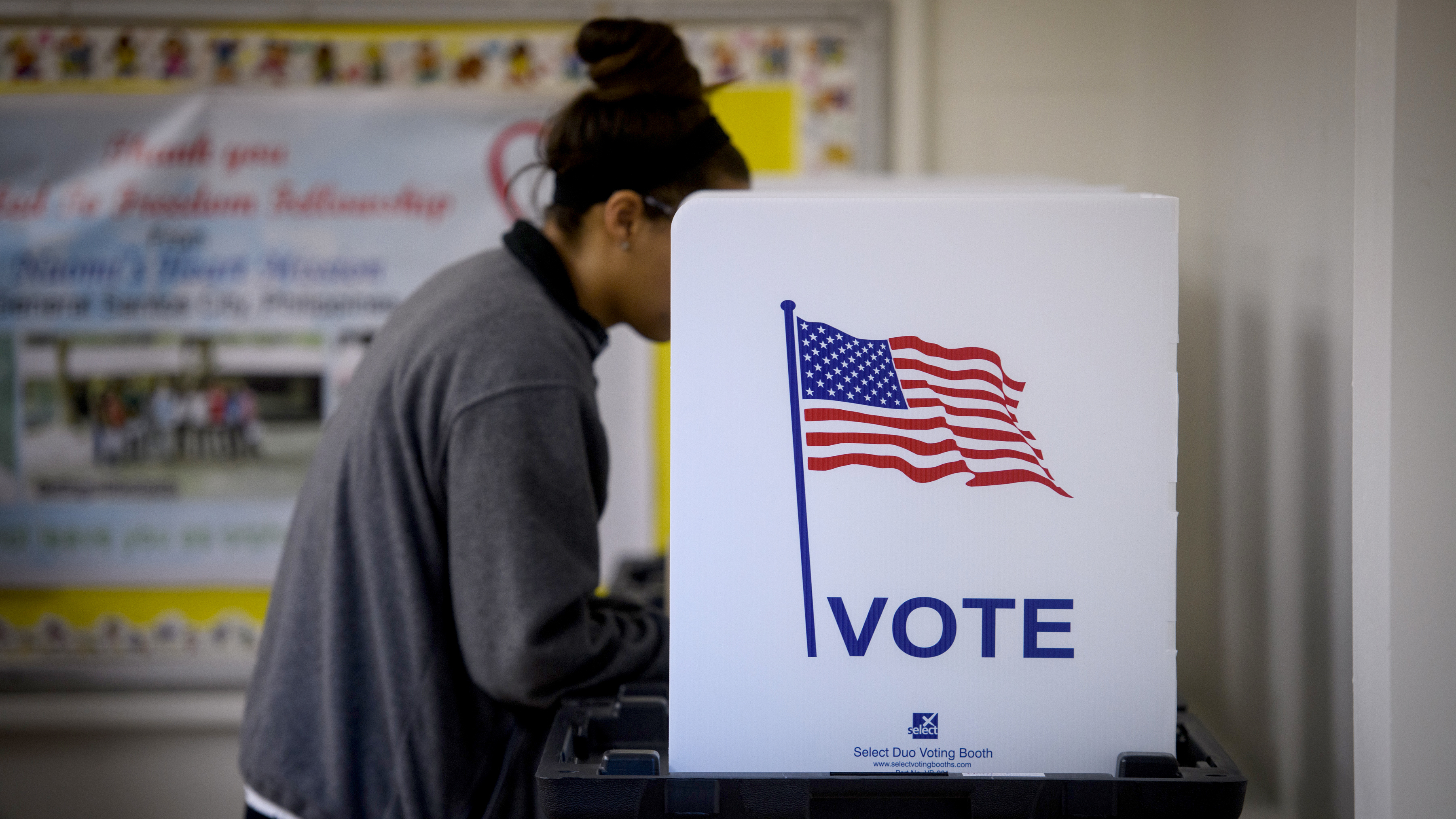 A woman votes Tuesday in Cambridge, Ohio. More than a dozen races were decided by a single vote or ended in a tie over the last 20 years. (Getty Images)