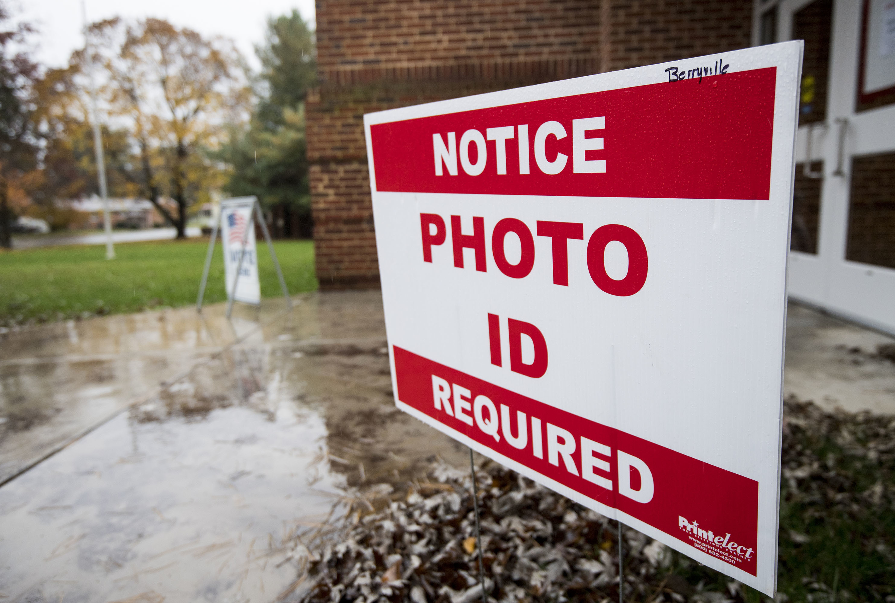 North Carolina will join Virginia and 17 other states that require voters to show a photo ID to vote. A sign notifies voters that a photo ID is required at the Clarke County Schools office polling location in Berryville, Va., on Nov. 6, 2018. (CQ-Roll Call,Inc./Getty Images)