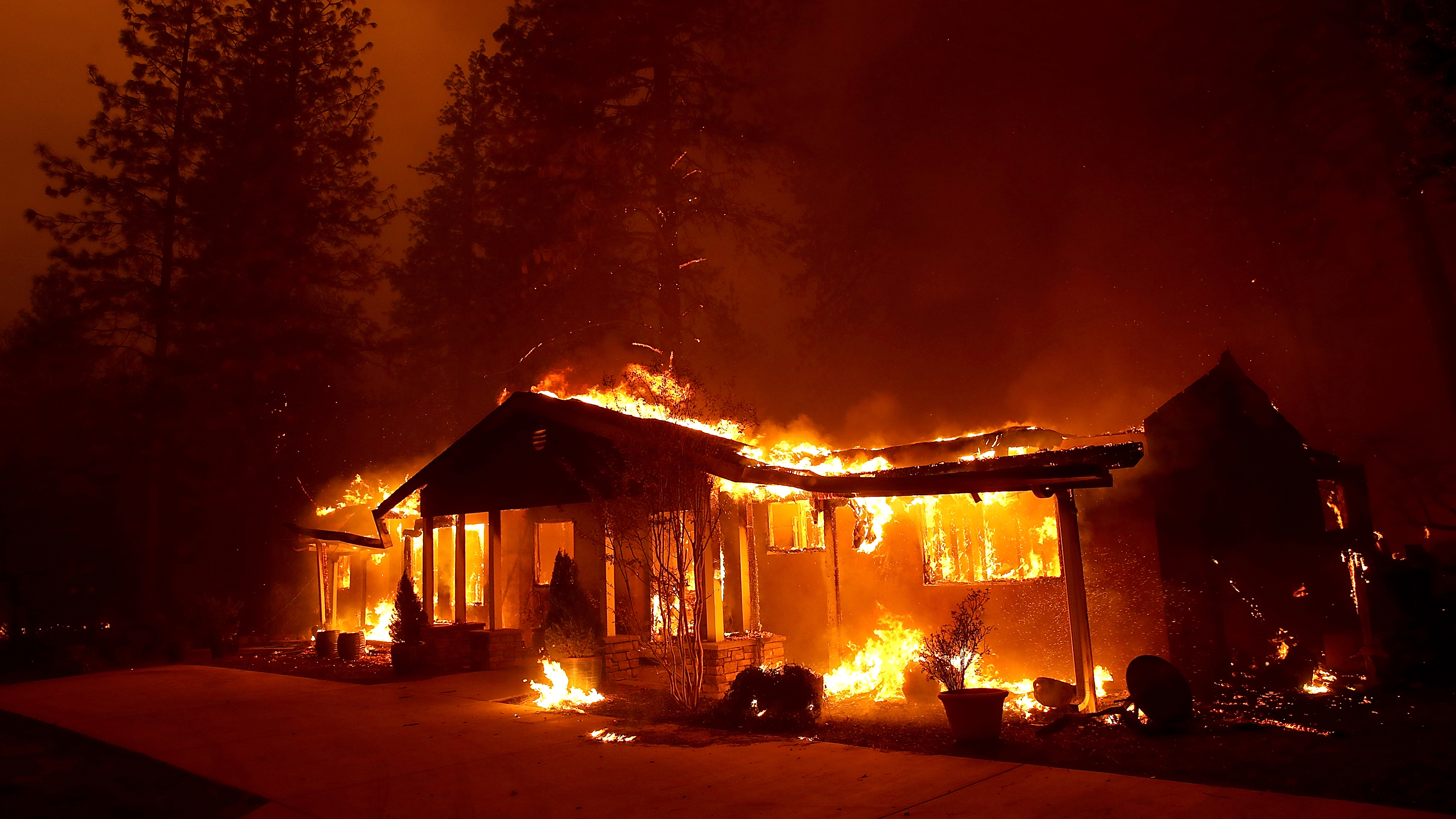 A home burns as the Camp Fire moves through the area on Thursday in Paradise, Calif. Fueled by high winds and low humidity, the rapidly spreading Camp Fire has ripped through the town of Paradise. (Getty Images)