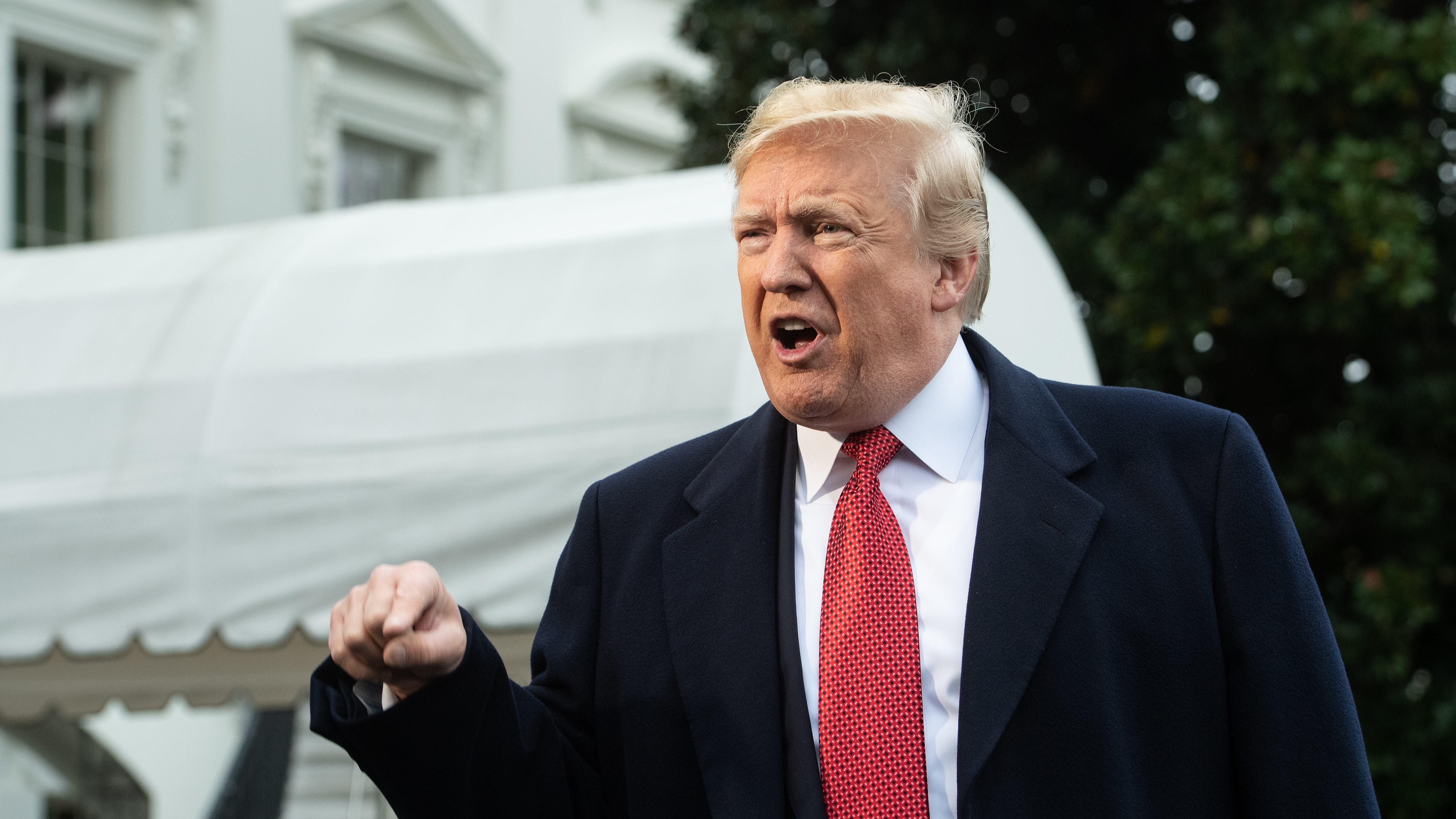 President Trump speaks to reporters at the White House on Friday. The president has joined Florida Gov. Rick Scott in amplifying claims of voter fraud in the state's Senate race despite lack of evidence. (AFP/Getty Images)