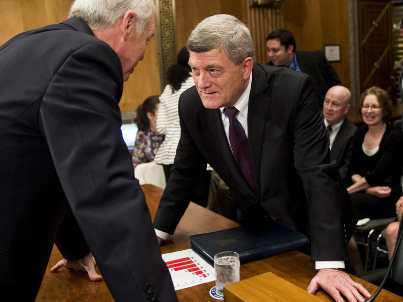President Trump's nominee for Census Bureau director, Steven Dillingham (center), speaks with Sen. Ron Johnson, R-Wisc., at his Oct. 3 confirmation hearing before the Senate Homeland Security and Governmental Affairs Committee. (Bill Clark/CQ-Roll Call, Inc./Getty Images)