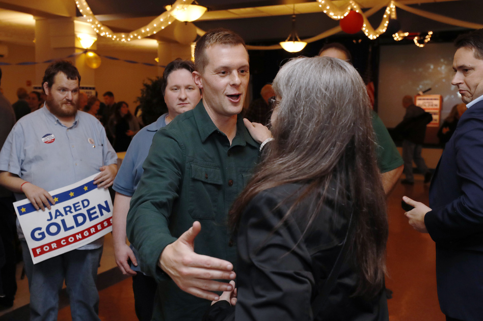 Democrat Jared Golden greets supporters as they wait on Election Day in Lewiston, Maine. Golden was declared the winner on Thursday as a result of the state's new ranked-choice voting system. (Joel Page/AP)