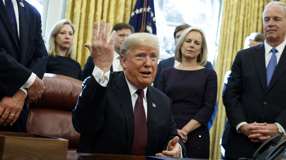 President Trump answers a reporter's question about special counsel Robert Mueller's investigation during a bill signing ceremony Friday in the Oval Office. (Evan Vucci/AP)