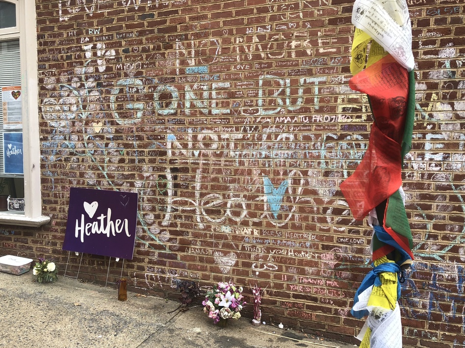 A makeshift memorial on the street where Heather Heyer was killed when a car rammed into a crowd during a white supremacist rally in 2017. (Debbie Elliott/NPR)