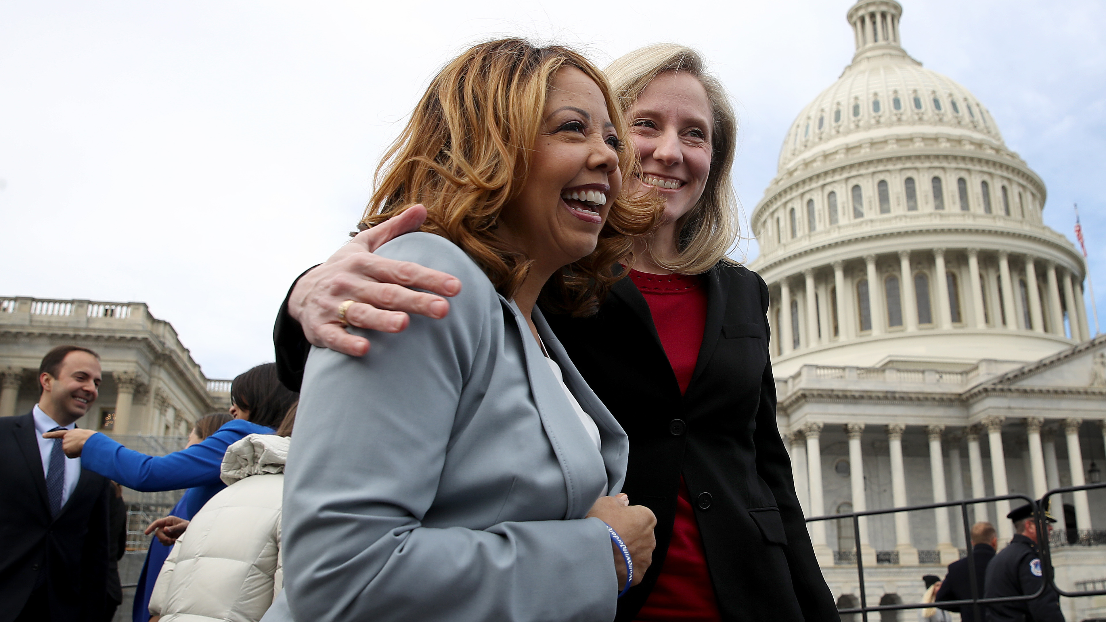 Newly elected members of the House of Representatives Lucy McBath and Abigail Spanberger meet in front of the U.S. Capitol. Both women represent newly Democratic suburban districts.