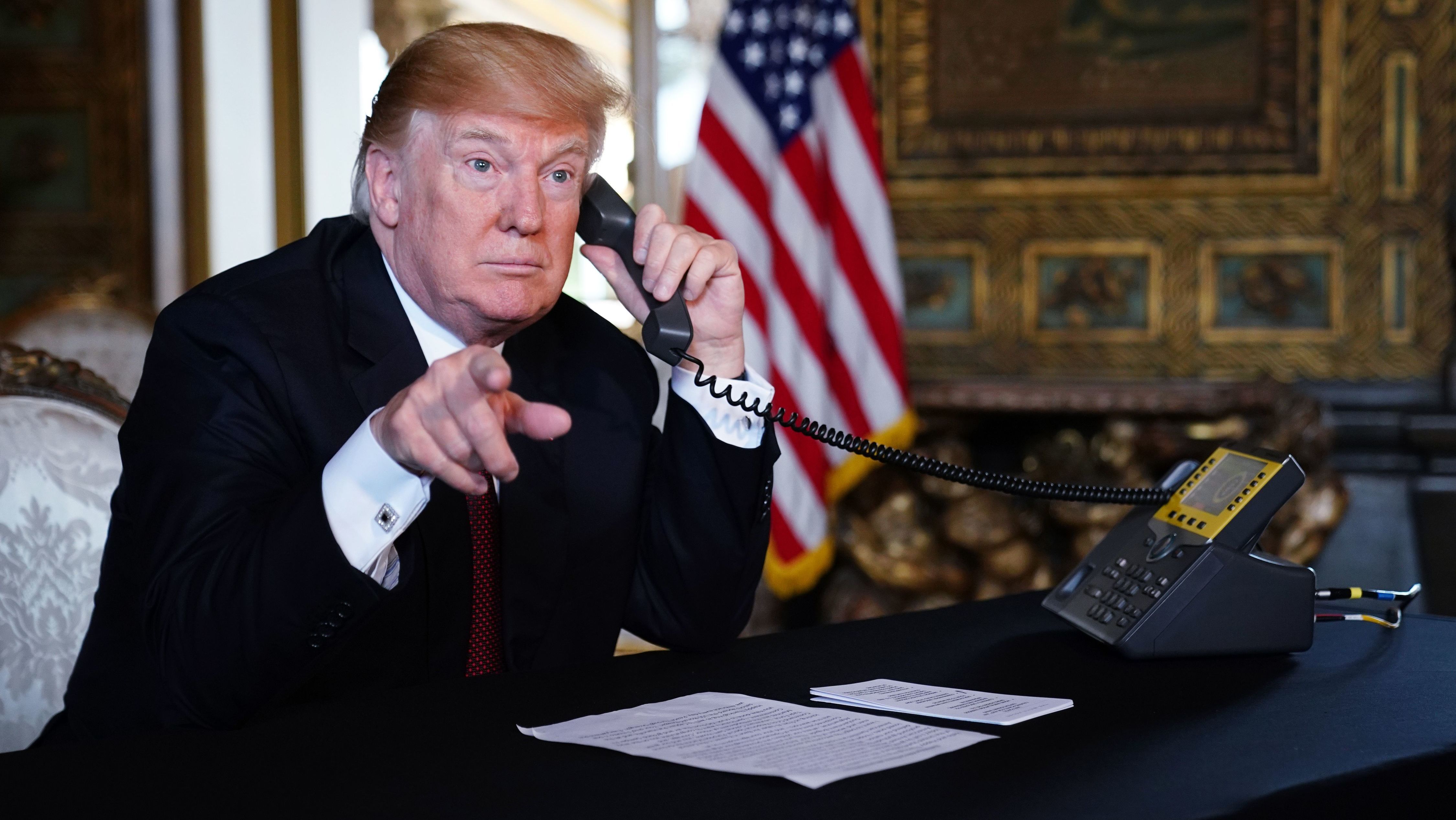 President Trump speaks to members of the military over the phone Thursday from his Mar-a-Lago resort in Palm Beach, Fla. (AFP/Getty Images)