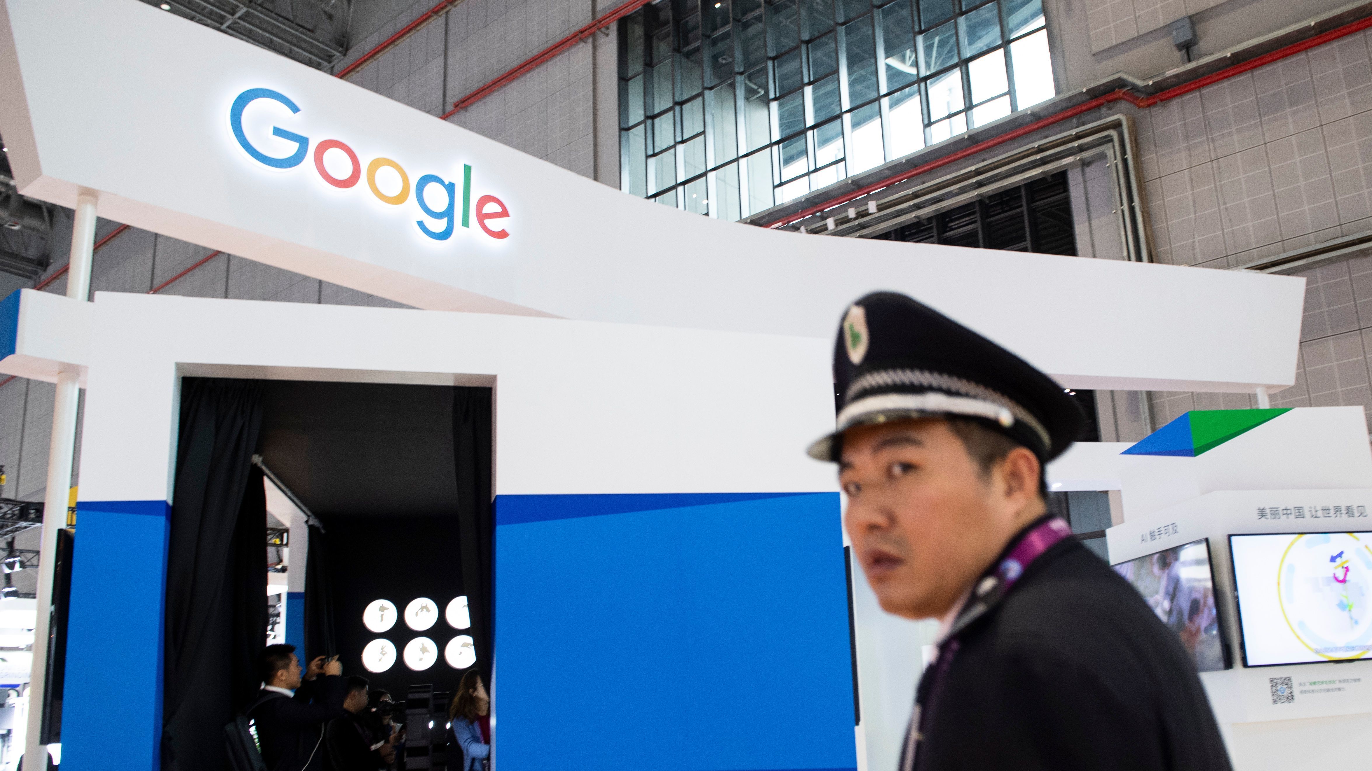 A security guard stands in front of Google's booth at the China International Import Expo earlier this month in Shanghai. (AFP/Getty Images)