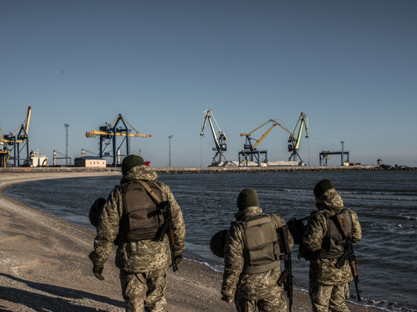 Ukraine's Border Security Force soldiers patrol the coast of the Azov Sea near Mariupol Port on Thursday.