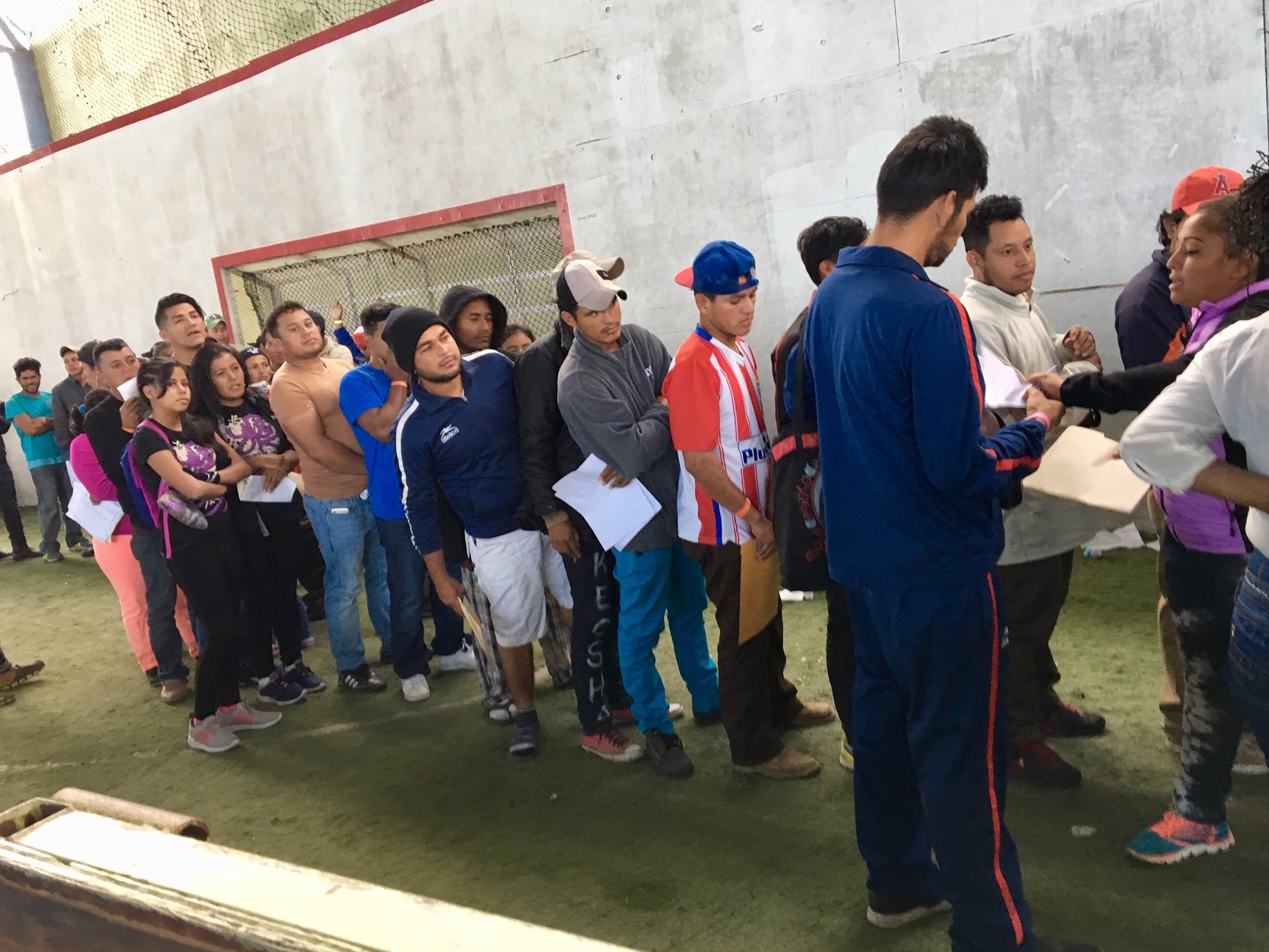 Central American migrants line up to apply for jobs at a job fair in Tijuana, Mexico. More than two thousand migrants have applied for a one-year humanitarian visa that would allow them to hold jobs legally in Mexico. (NPR)
