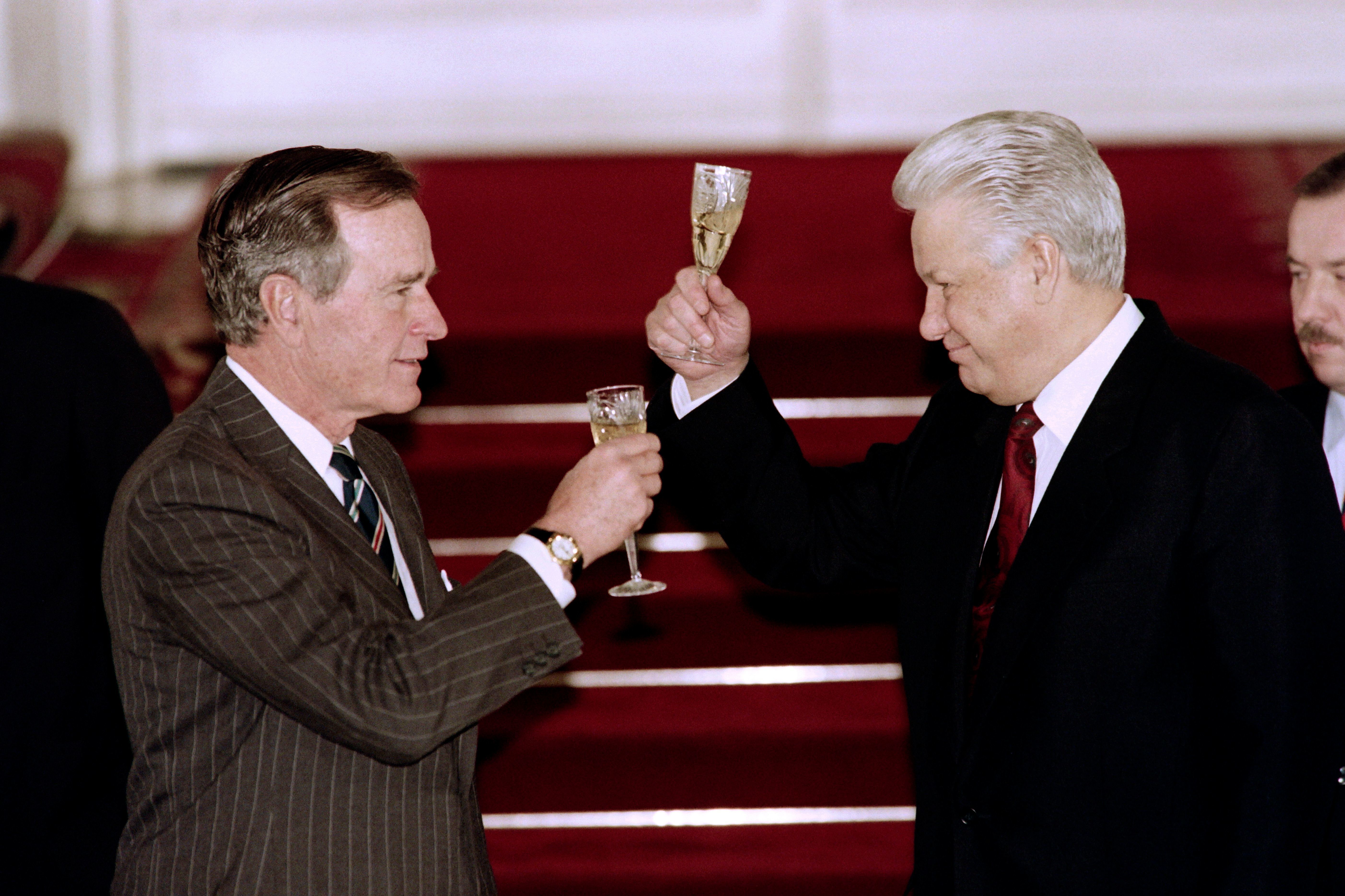 President George H.W. Bush and Russian President Boris Yeltsin toast to each other after signing an arms control treaty in January 1993 in Moscow. Bush skillfully cultivated relationships with both Yeltsin and his Soviet predecessor, Mikhail Gorbachev. (AFP/Getty Images)