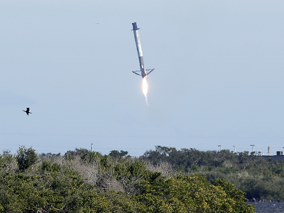 Falcon 9 rocket first stage booster experiencing control problems and missing a landing zone at Cape Canaveral, Fla.