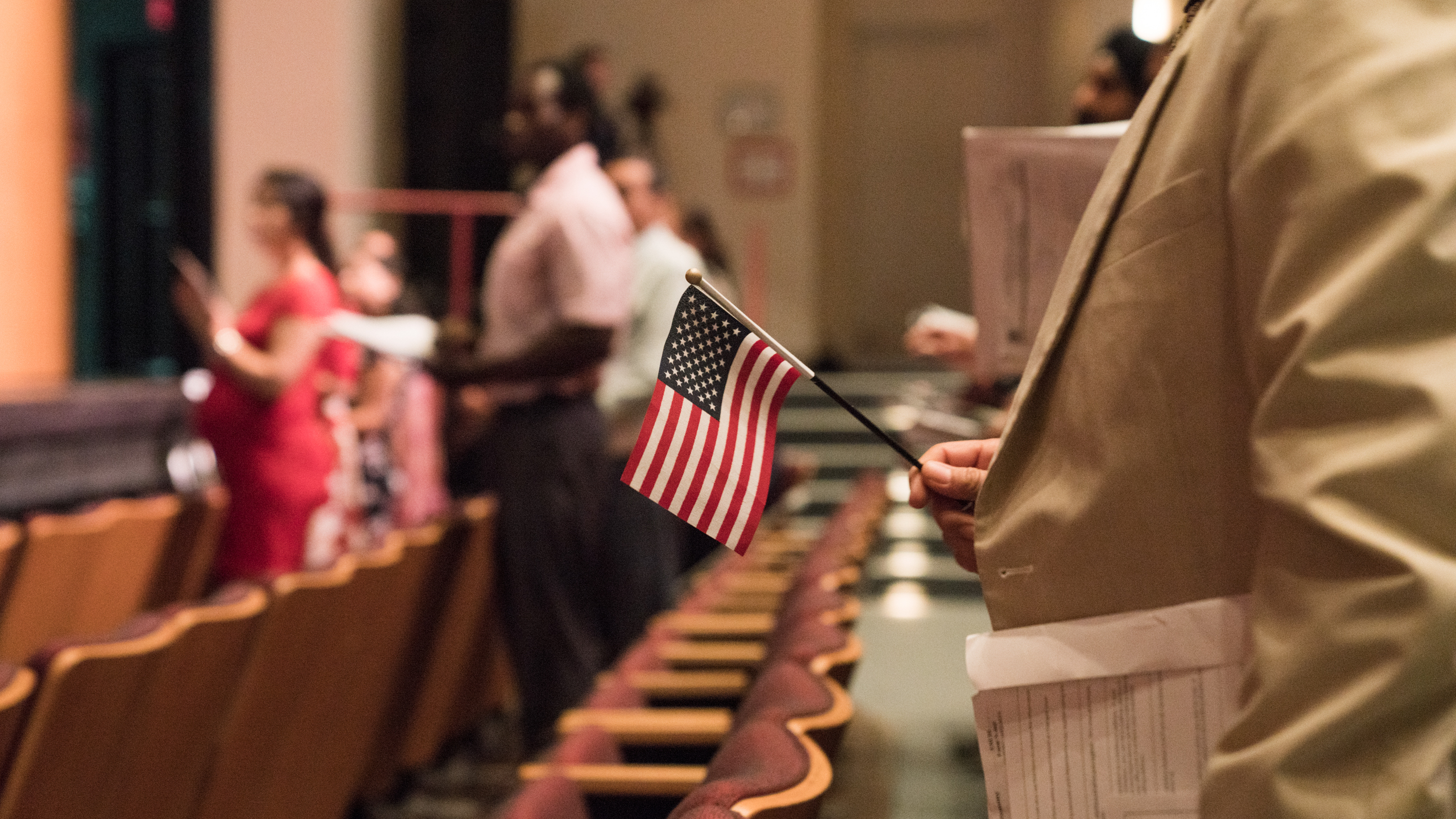 Newly sworn-in U.S. citizens stand during a naturalization ceremony in Alexandria, Va., in August. The Census Bureau is planning to test how a question about U.S. citizenship status the Trump administration added will affect responses to the 2020 census. (NPR)