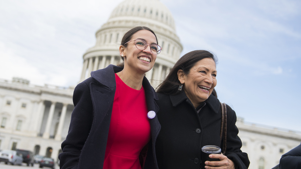 Democratic Rep.-elect Alexandria Ocasio-Cortez of New York (left) has pledged to pay her interns $15 an hour. She is seen here with Democratic Rep.-elect Deb Haaland of New Mexico.