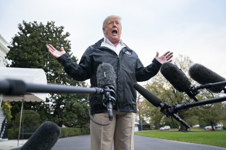 President Trump speaks to reporters before departing the White House for California in November. (Jim Lo Scalzo/Pool/Getty Images)