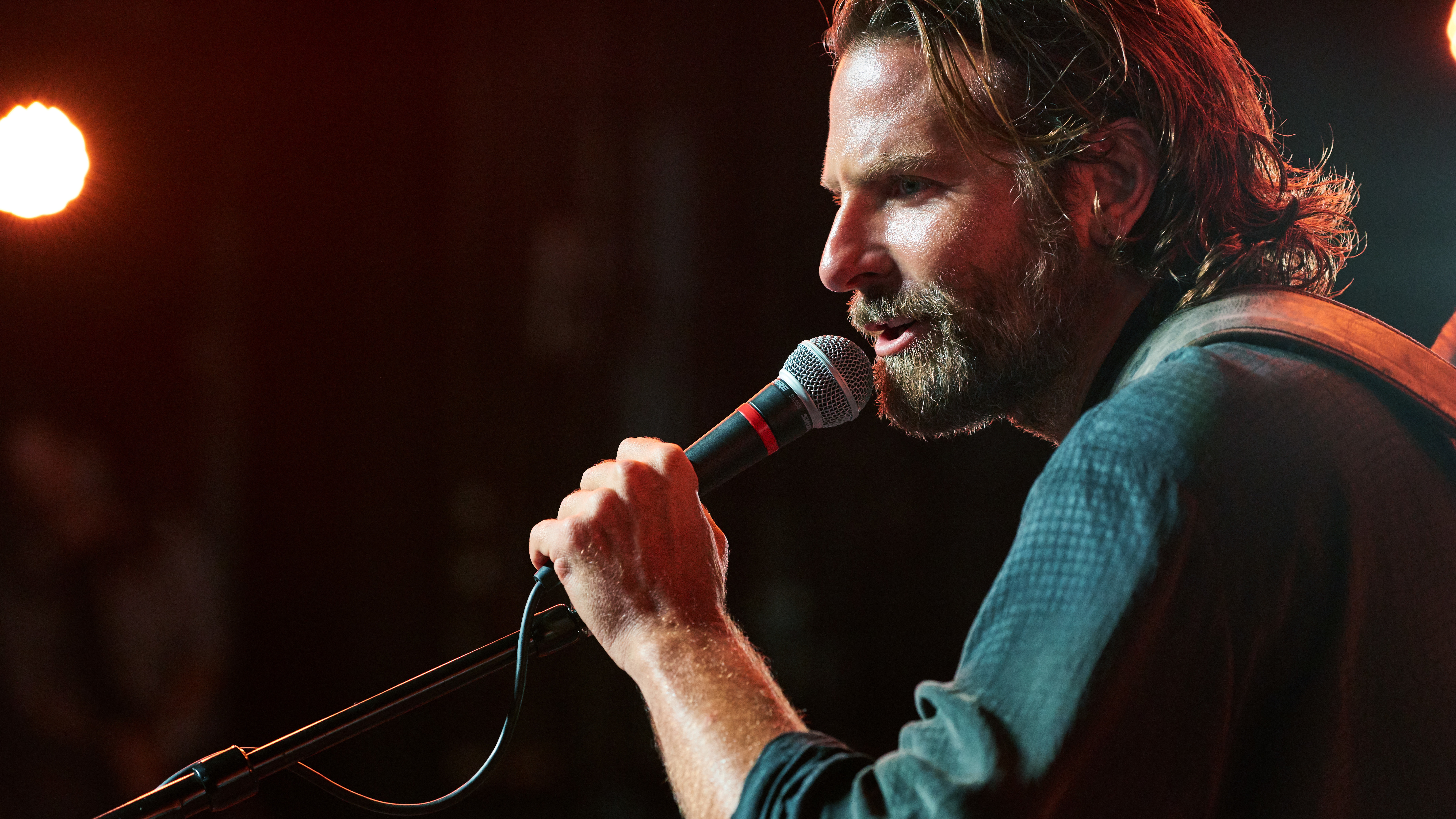 Bradley Cooper plays Jackson Maine, a musician struggling with addiction, in A Star Is Born.