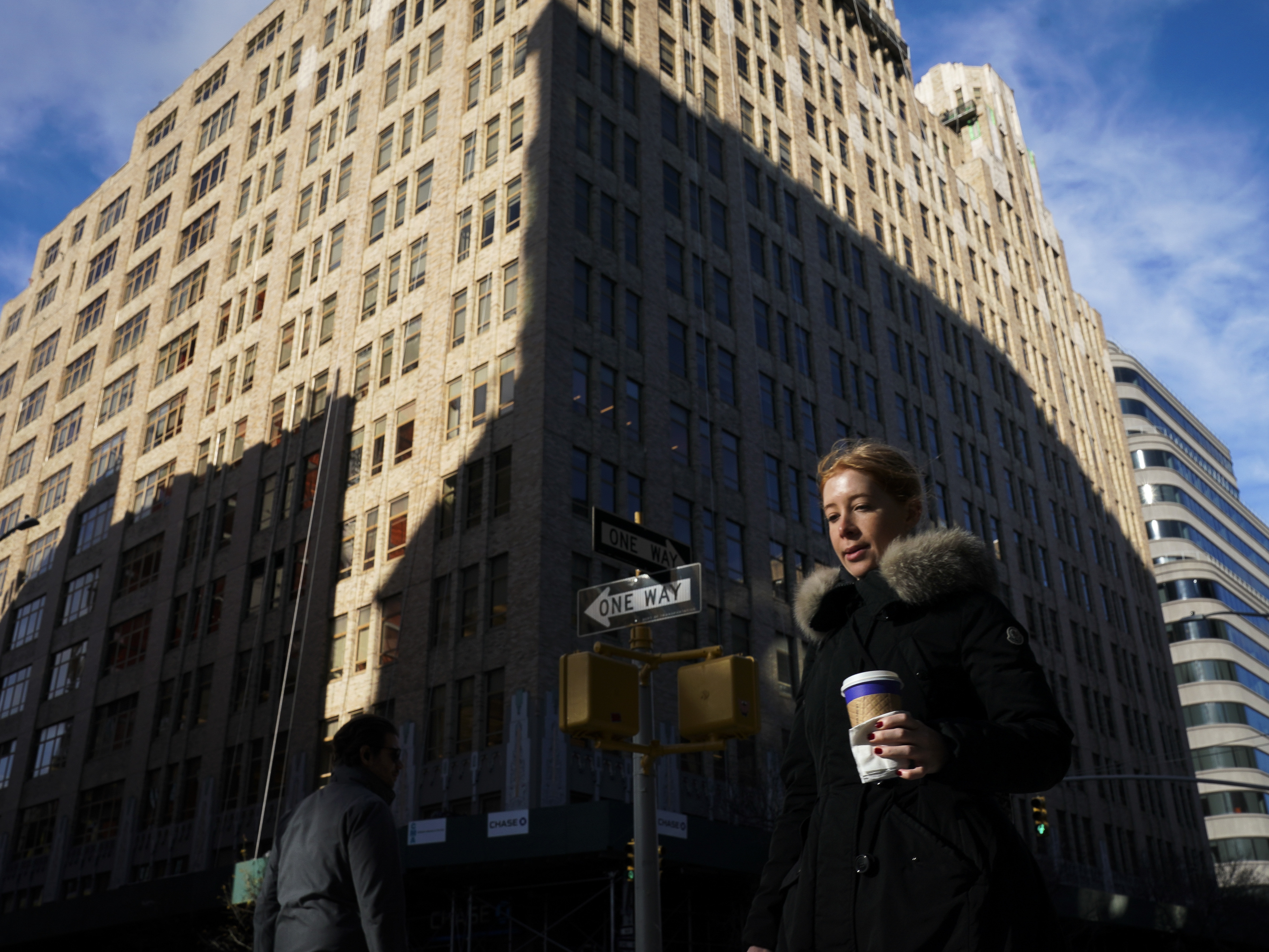 Google says it will lease office space at three spots in the West Village to create a new campus for thousands of workers in New York City. Here, a pedestrian passes by 345 Hudson Street, one of the buildings Google will be using. (Getty Images)