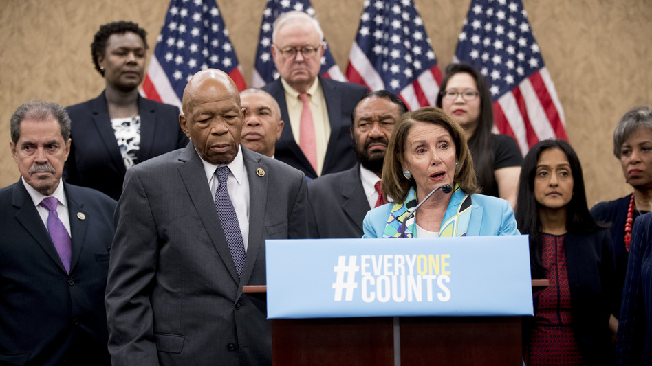 Nancy Pelosi of California, now House speaker, joins fellow Democrats, including Reps. José Serrano of New York and Elijah Cummings of Maryland, as well as other census advocates at a May 2018 press conference in Washington, D.C., about the new citizenship question on the 2020 census. (Andrew Harnik/AP)