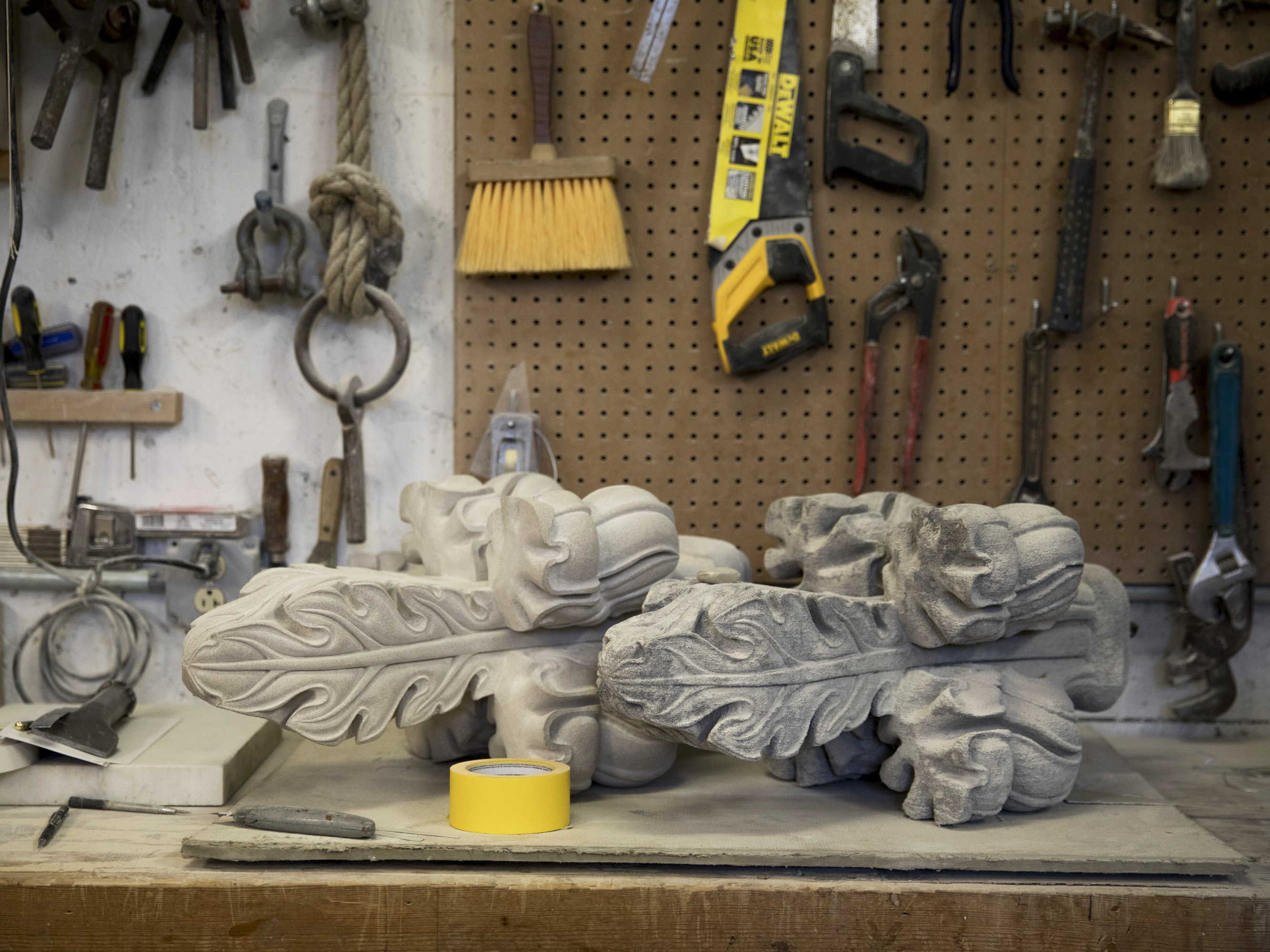 Chip By Chip, Restoring The Damaged Washington National Cathedral 2 In the stonemasons shop, one of the finials that fell during the earthquake is on the right, and the replacement is on the left.