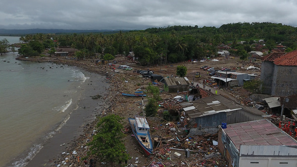 Damaged houses, boats and debris are seen after a tsunami in this aerial photo taken in Sumur, Pandeglang, Banten province, Indonesia, on Tuesday. The death toll from a tsunami now exceeds 400.