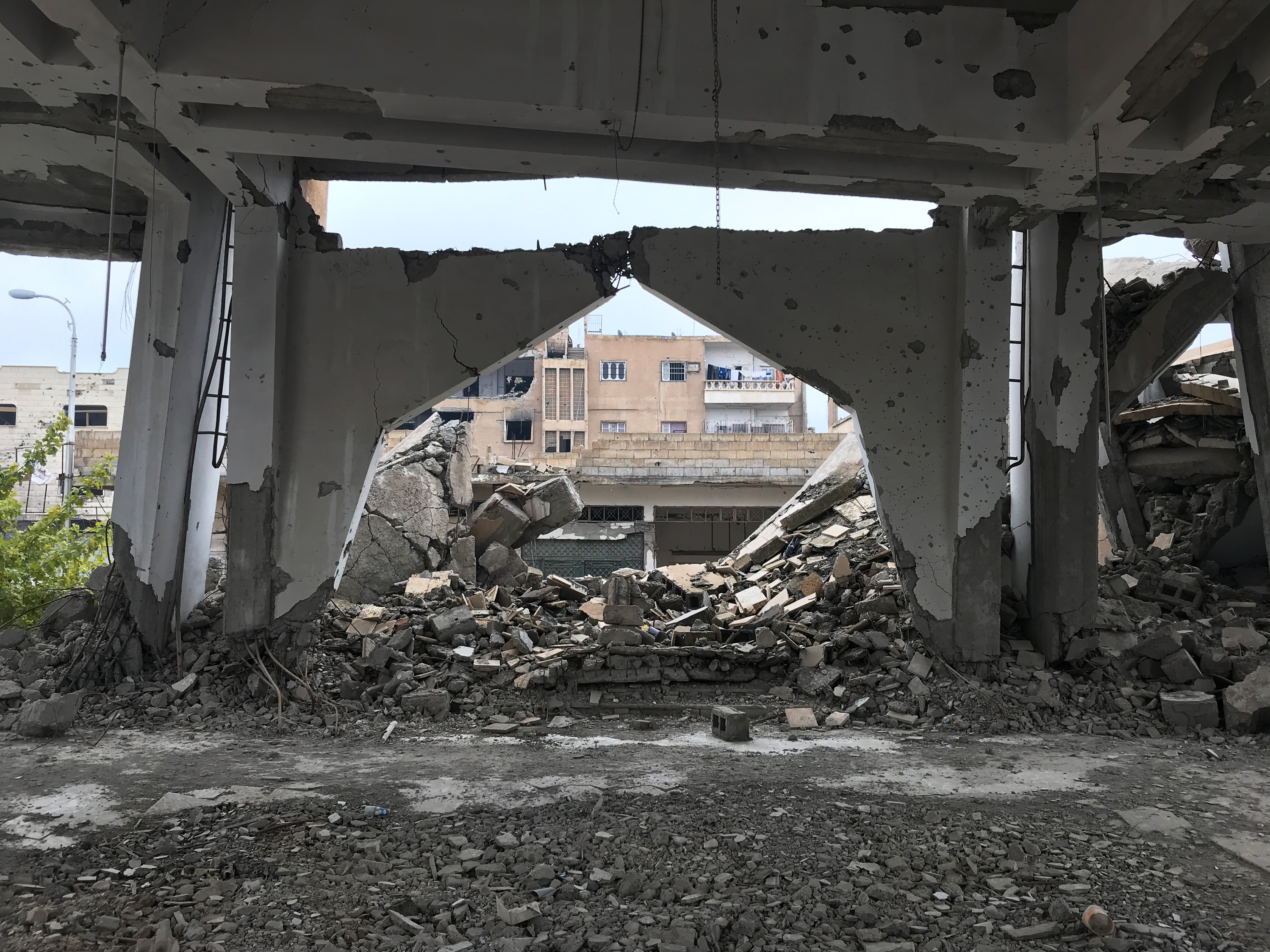 A church near the school was destroyed during the fight to oust ISIS from Raqqa, Syria. (NPR)