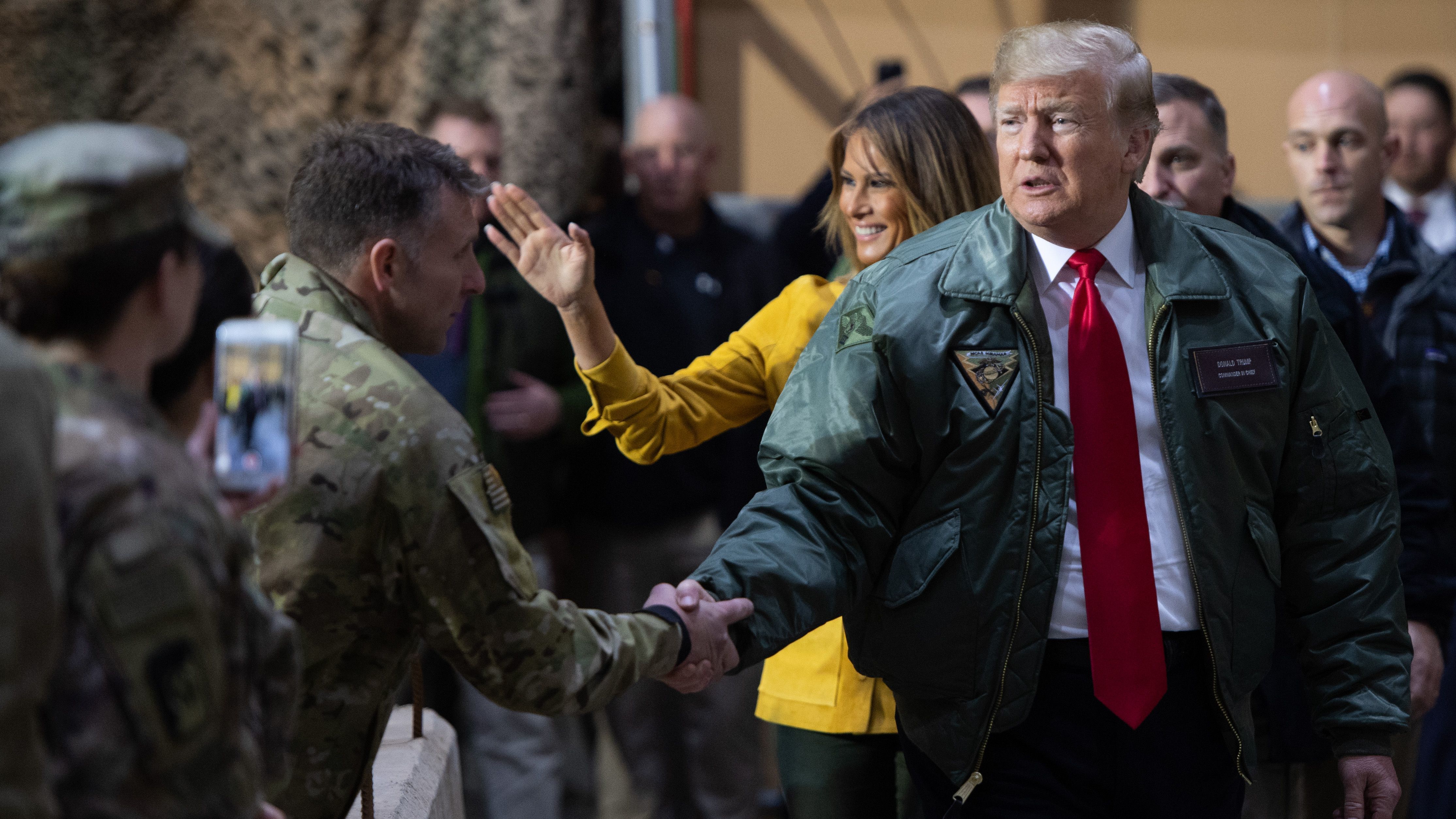 President Trump and first lady Melania Trump arrive to speak to members of the U.S. military during an unannounced trip to Al Asad Air Base in Iraq on Dec. 26. (AFP/Getty Images)