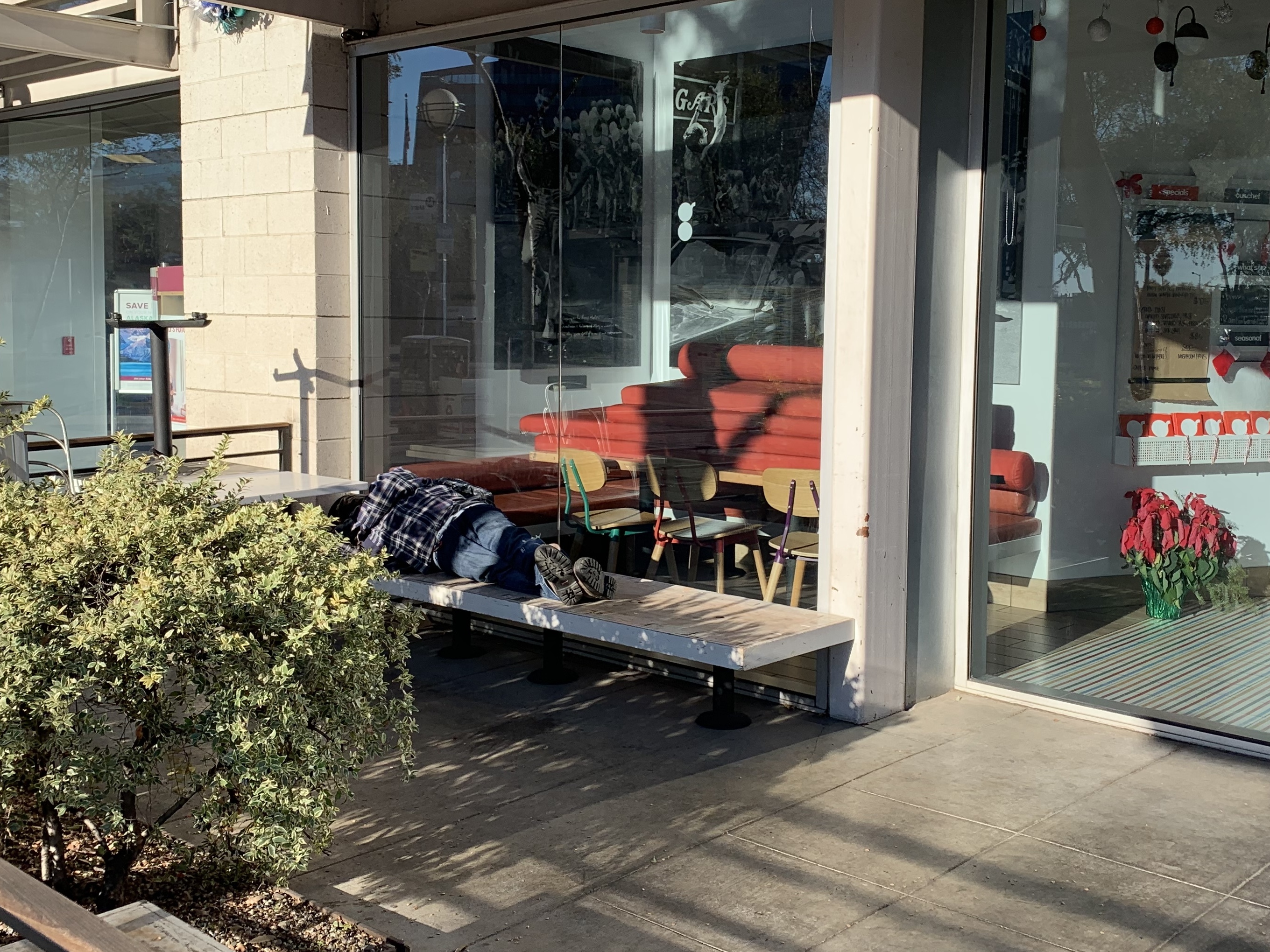 Despite big investments in new housing services, tens of thousands of men and women still sleep on the streets in and around L.A., like this man in West Hollywood. (KCRW)