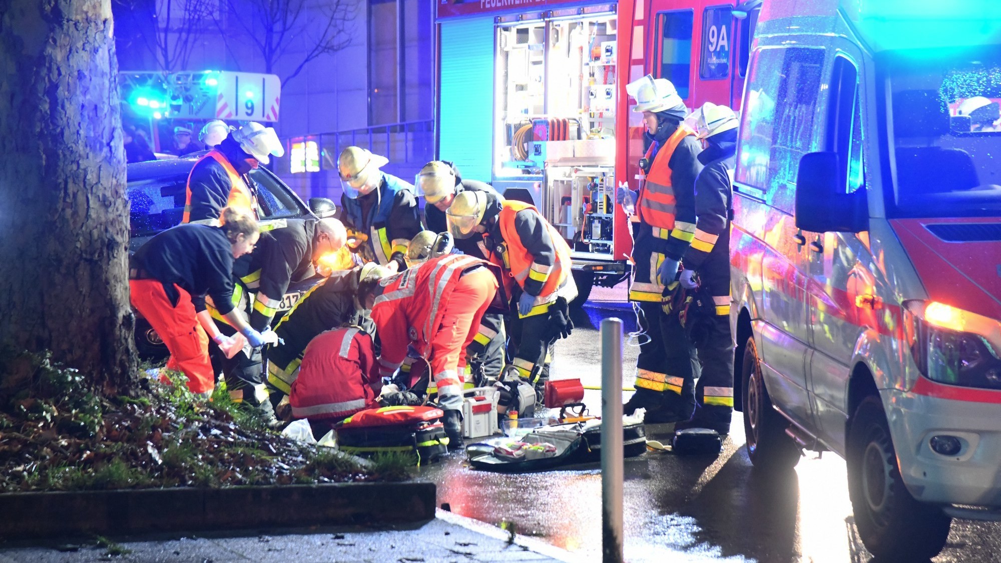 Paramedics and an emergency doctor bend over a man who had been run over by a car near the Museum Folkwang in North Rhine-Westphalia, Essen, on Tuesday.