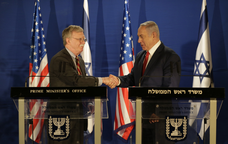 U.S. National Security Advisor John Bolton (left) and Israeli Prime Minister Benjamin Netanyahu shake hands during a joint statement to the media follow their meeting, in Jerusalem on Sunday. (Oded Balilty/AP)