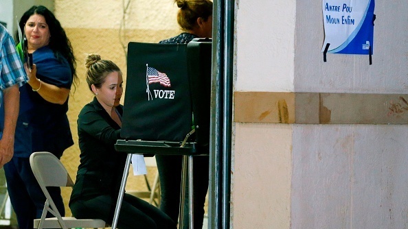 South Florida voters cast their vote late in the day at a busy polling center in Miami on Nov. 6, 2018. (AFP/Getty Images)