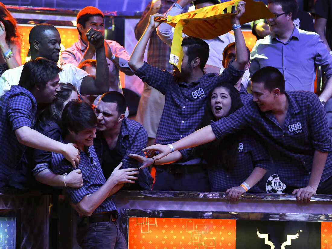 Friends congratulate Jake Balsiger during the World Series of Poker Final Table event in 2012.