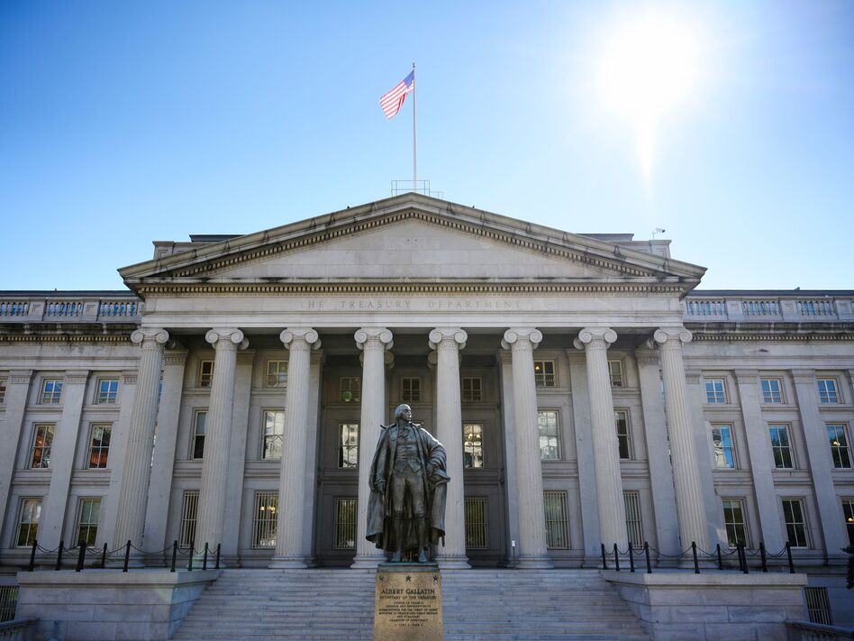 A downgrade in the nation's credit rating could lead to higher borrowing costs for the U.S. Treasury, companies and consumers. (Mandel Ngan/AFP/Getty Images)