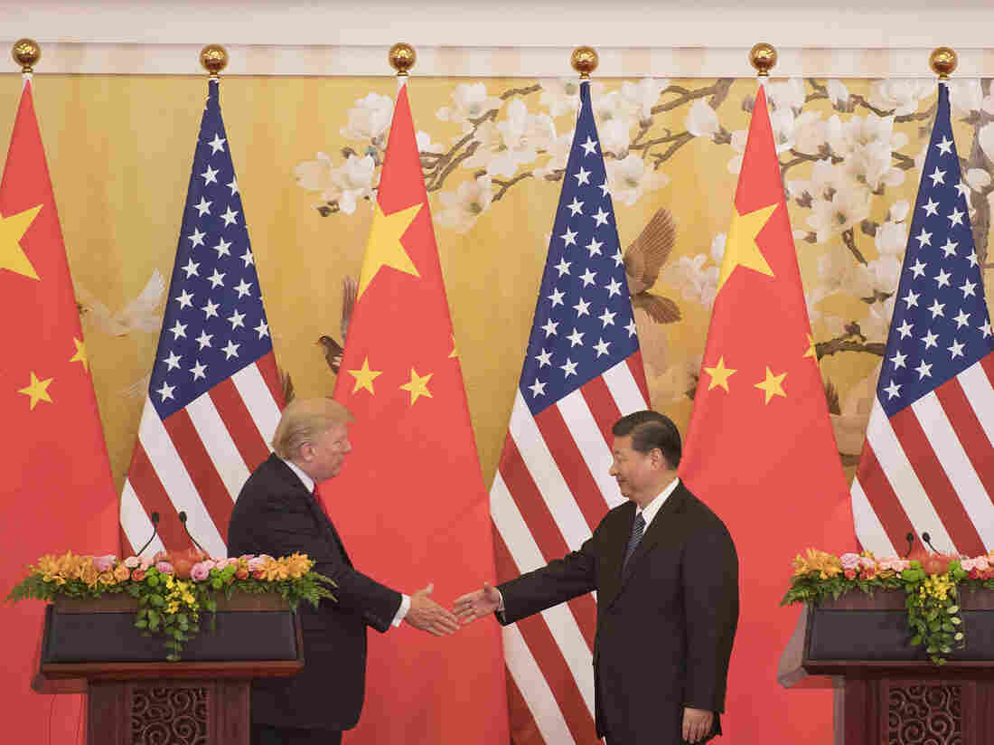 President Donald Trump and Chinese President Xi Jinping shake hands during a joint statement in Beijing last November. Donald Trump, among the least popular US presidents in decades and the newly empowered Chinese leader met for talks on trade and North Korea.