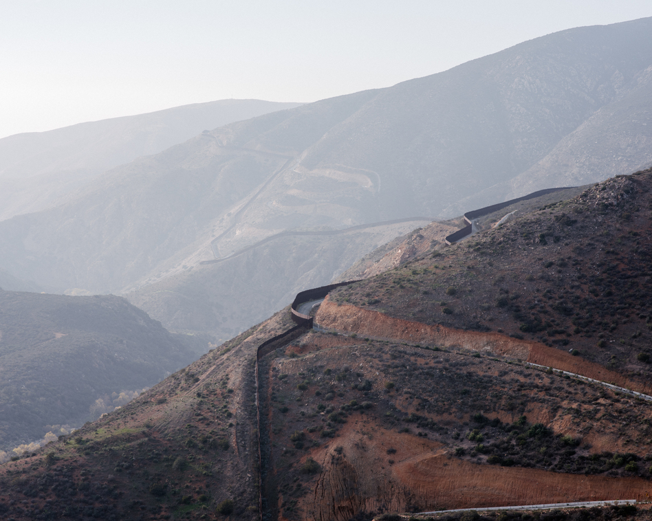 A view of the U.S.-Mexico border fence as it heads west through the San Ysidro Mountains, seen from San Diego, Calif. (John Francis Peters for NPR)
