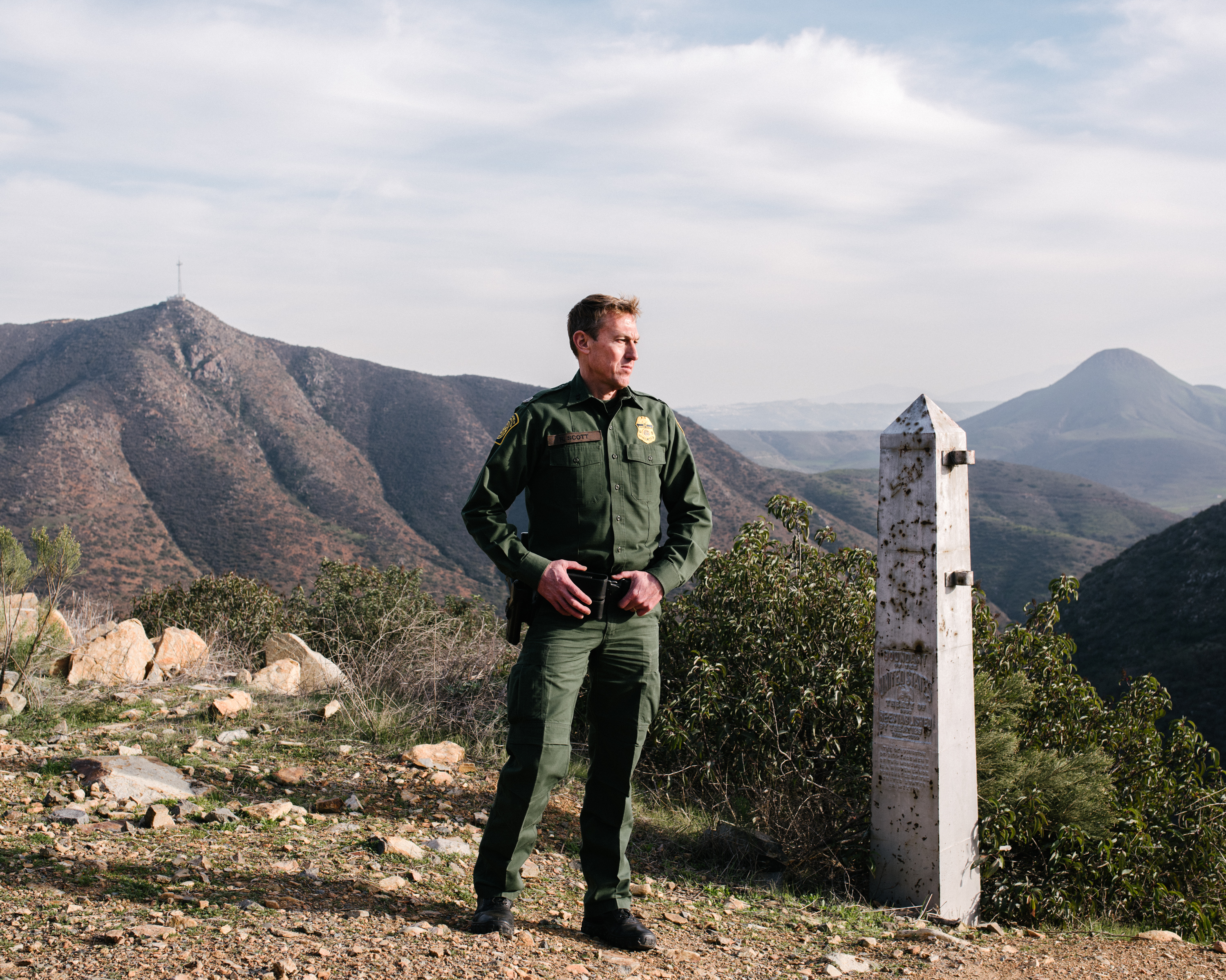 Chief Patrol Agent Rodney Scott stands near an old border monument at the base of the San Ysidro Mountains in southern San Diego County where current fencing ends. (John Francis Peters for NPR)