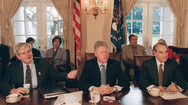 Then-House Speaker Newt Gingrich gestures toward President Bill Clinton, as then-Senate GOP leader Bob Dole is to the right. They met to try and work through the government shutdown in 1995.