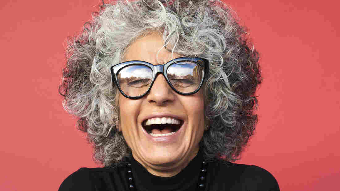A woman laughing.