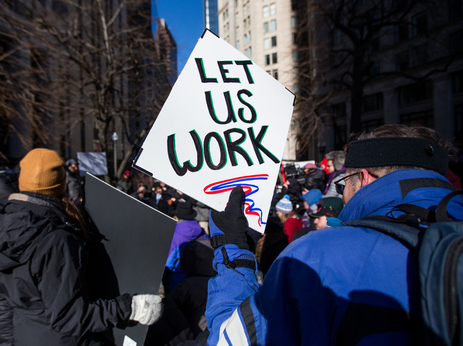 Demonstrators protest against the government shutdown in Boston on Friday. (Scott Eisen/Bloomberg via Getty Images)