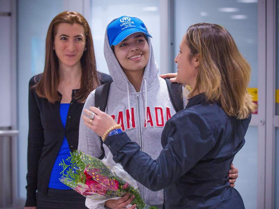 Rahaf Mohammed Alqunun (center) is welcomed by Canadian Minister for Foreign Affairs Chrystia Freeland as she arrives at Pearson International Airport in Toronto, Ontario, on Saturday. The young Saudi woman who fled her family successfully harnessed the power of Twitter to secure asylum in Canada. (Lars Hagberg /AFP/Getty Images)
