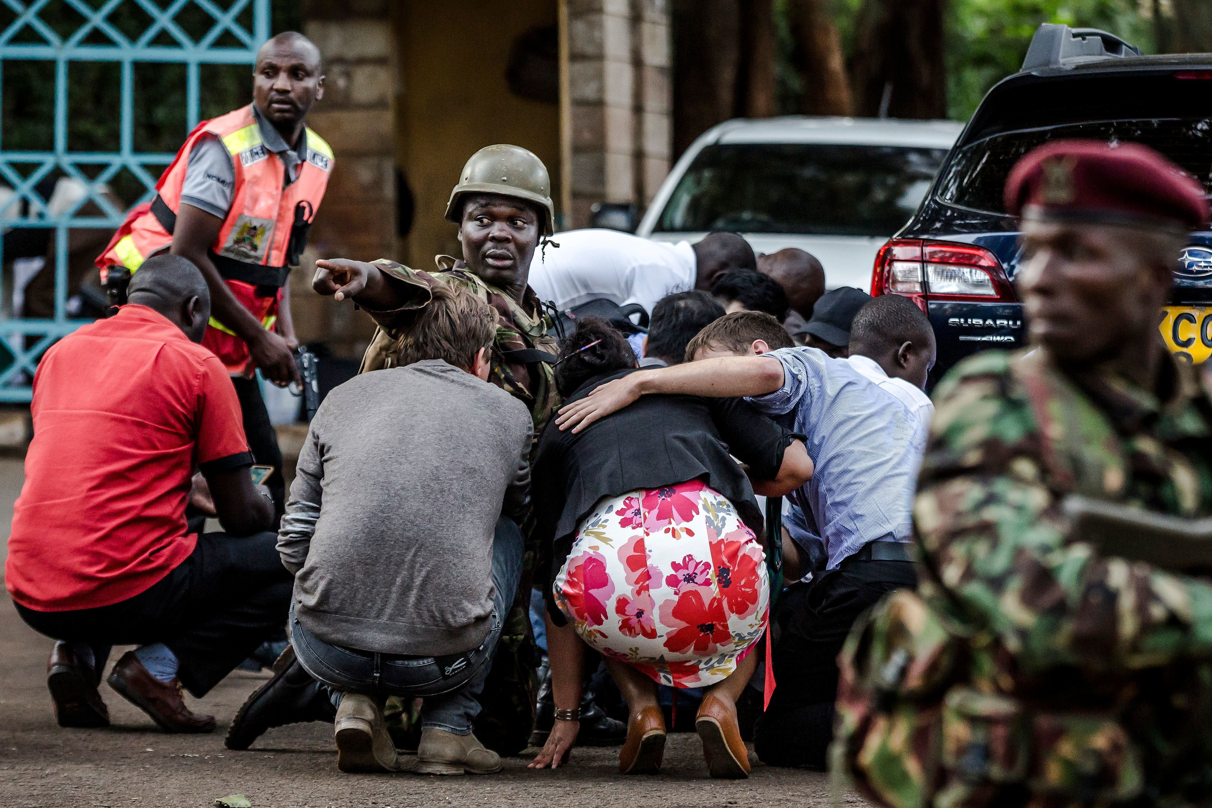 Special forces protect people at the scene of an explosion at a hotel complex in Nairobi on on Tuesday. The attack has been claimed by Al-Shabab, a Somalia-based terrorist group.