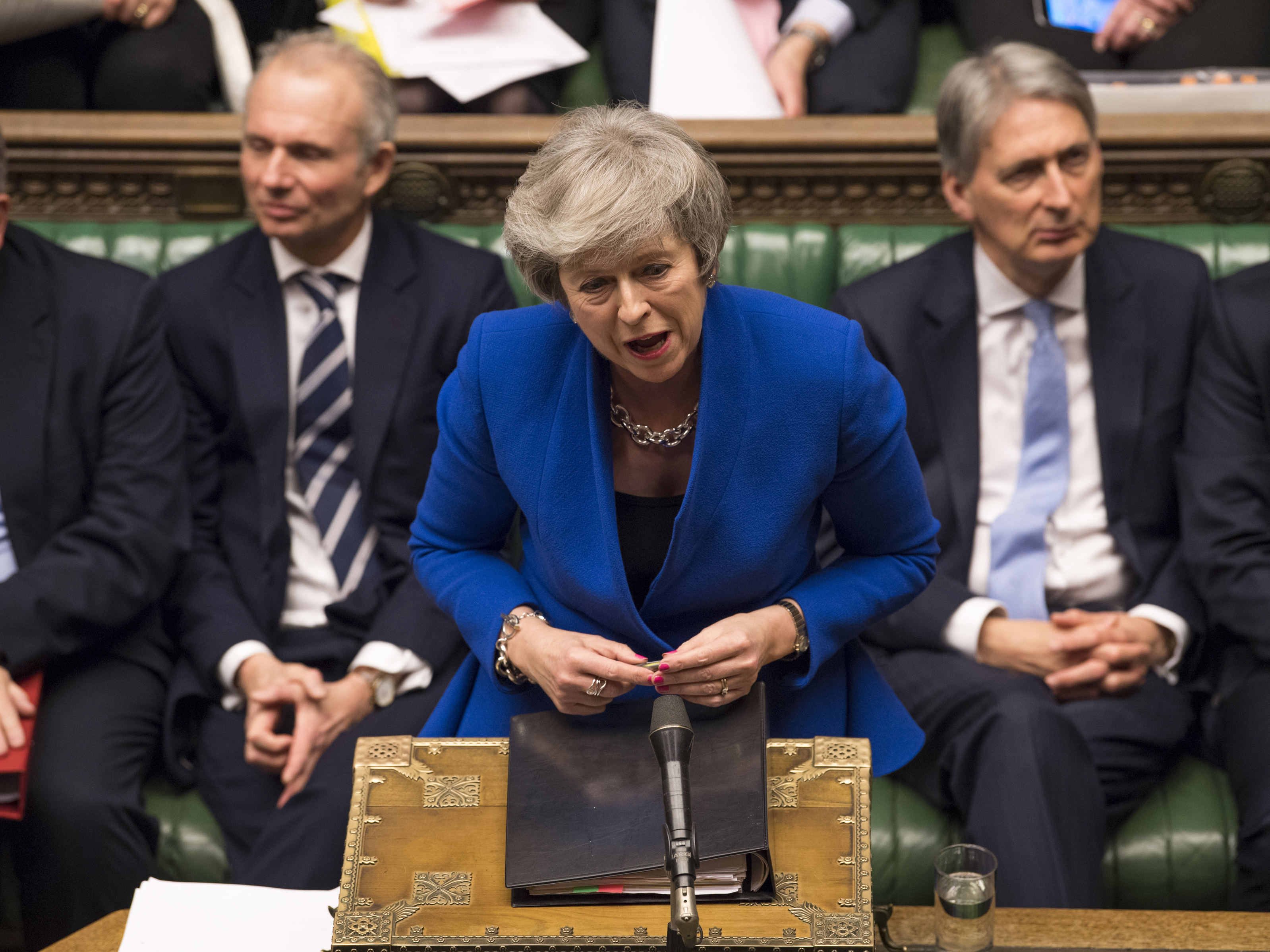 British Prime Minister Theresa May speaks Wednesday at the House of Commons in London during a debate before a no-confidence vote raised by opposition Labour Party leader Jeremy Corbyn. May withstood the challenge to her leadership.