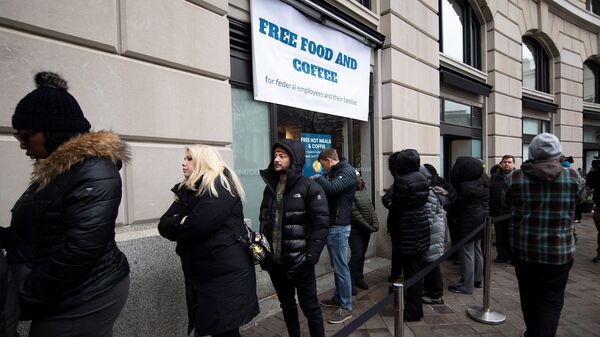Federal workers stand in line for a free hot meal in Washington, D.C., on Wednesday.