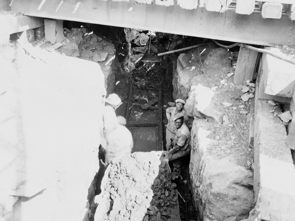 An African-American man poses with others in the photo above while working on the Hawks Nest Tunnel in 1932. Thousands of black men came to West Virginia to work on the project, making up the vast majority of the workforce.